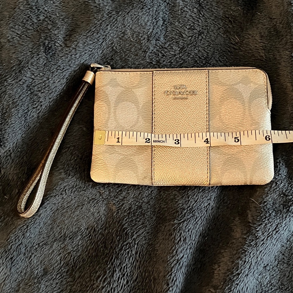 Metallic gold coach wristlet